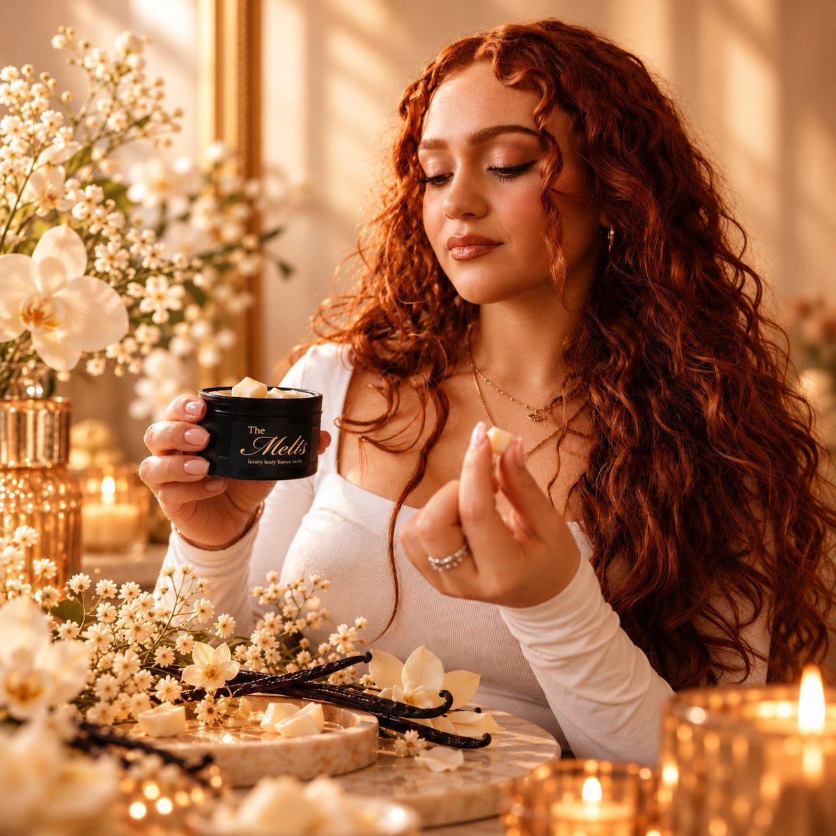 Woman holding a Palm Melts cube and tin, Kayali Vanilla 28 inspired scent